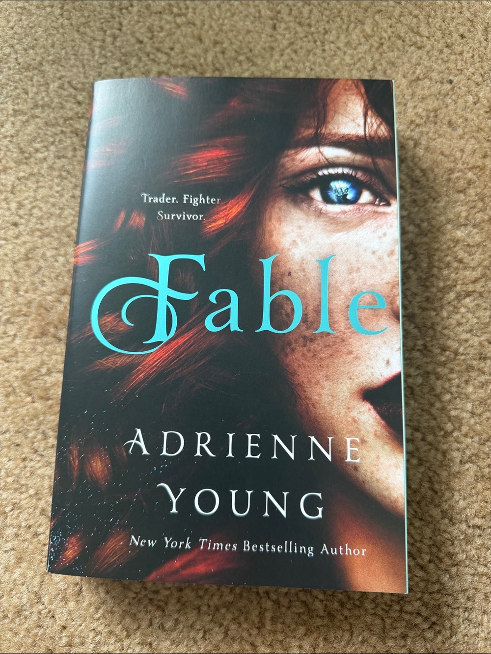 Fable by Adrienne Young - Paperback Book, Teal & Red Cover